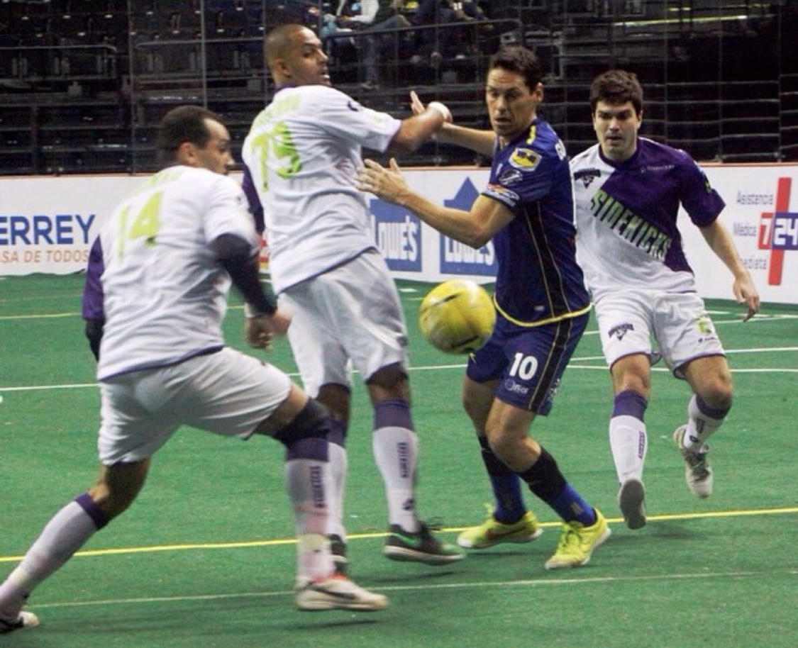 John marking former Mexico international Guillermo Franco during a Dallas Sidekicks game